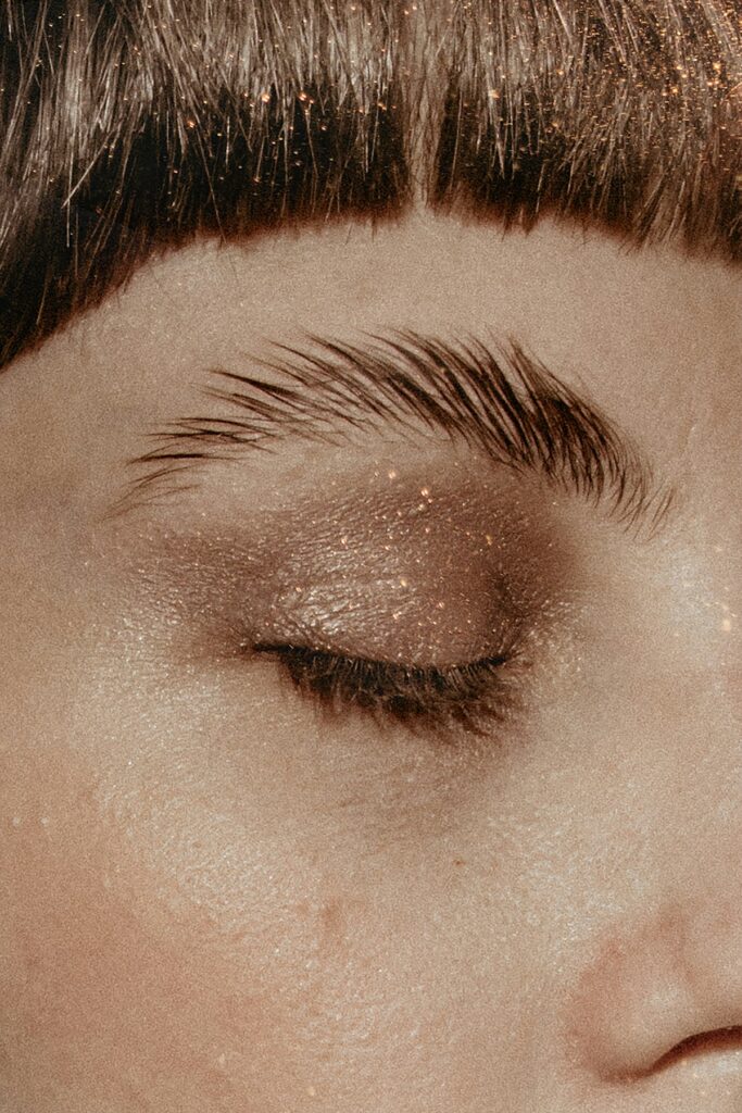Close-up of an eye with glitter on the lid