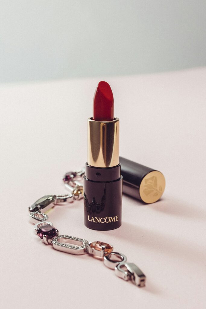 Red lipstick on a clean surface, year-end portrait