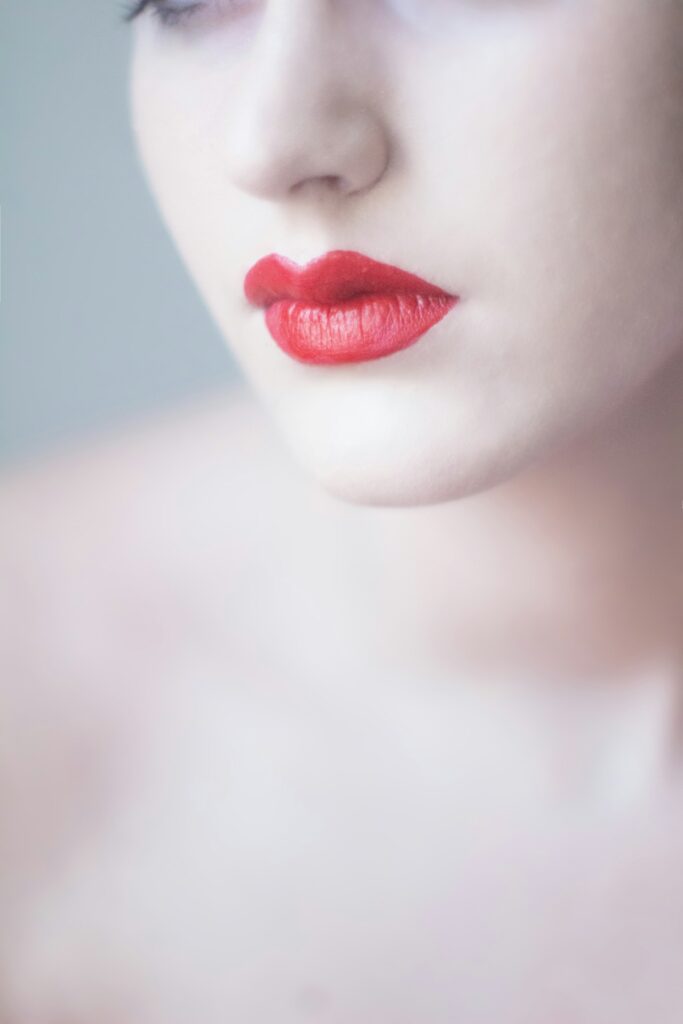 Red lipstick on a clean studio surface