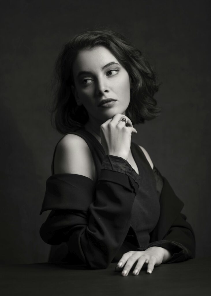 A woman in a black top in an editorial portrait