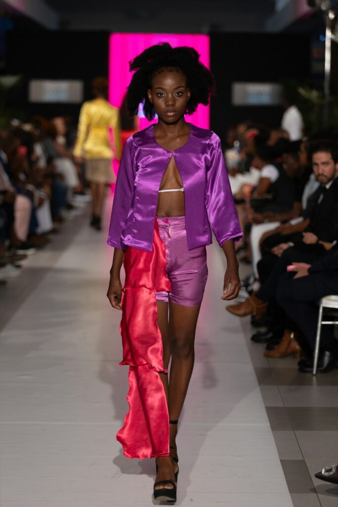 A fashion model walking a runway during a show