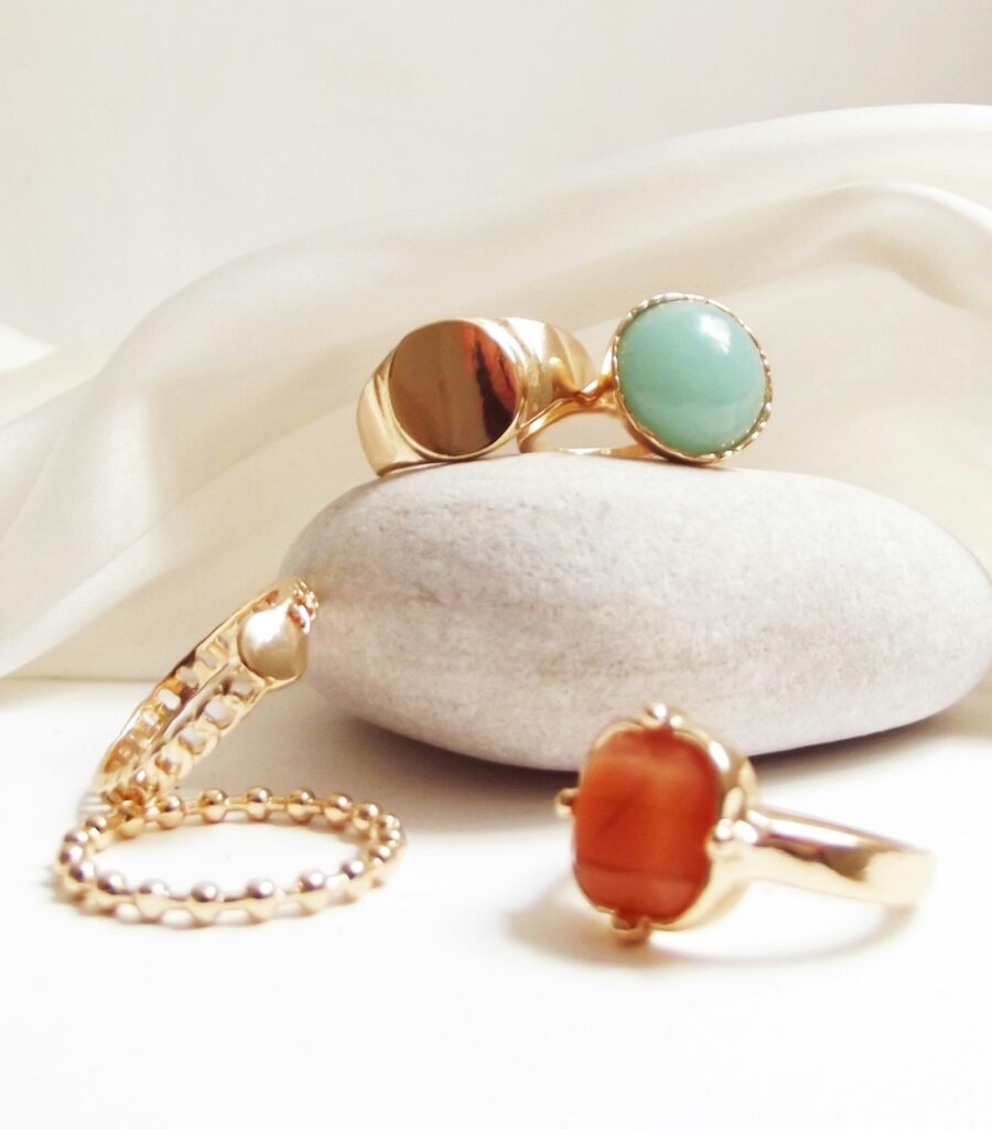 Stack of fine gold rings on a soft surface