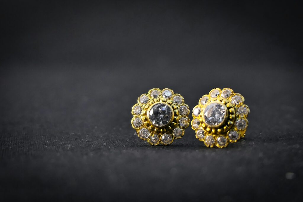 Diamond earrings on a soft surface in winter daylight
