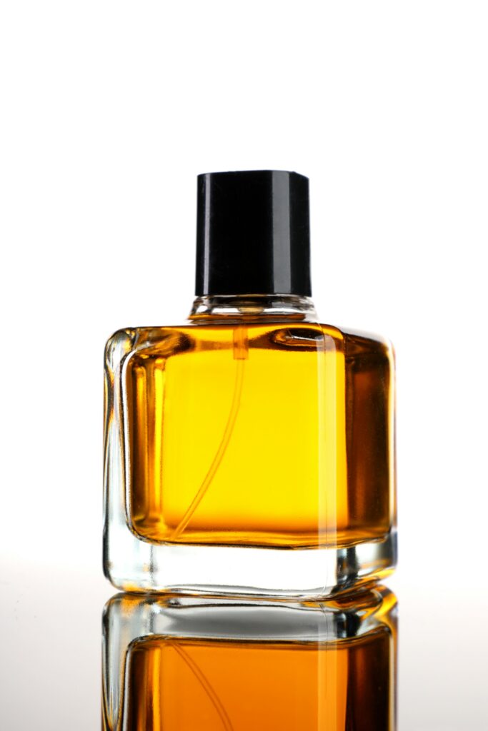 Amber perfume bottle on a wooden surface