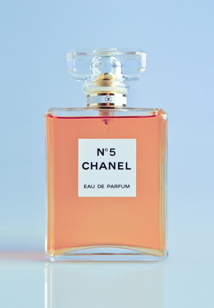 Glass perfume bottle on a sunny windowsill