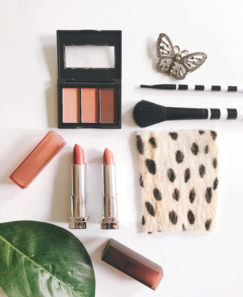 Holiday gift sets and seasonal lipsticks on velvet