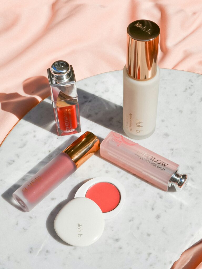 Beauty products arranged on a marble flatlay with autumn light